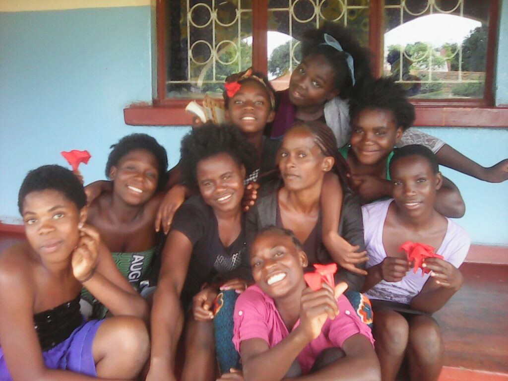 Young people gathered together outside a building